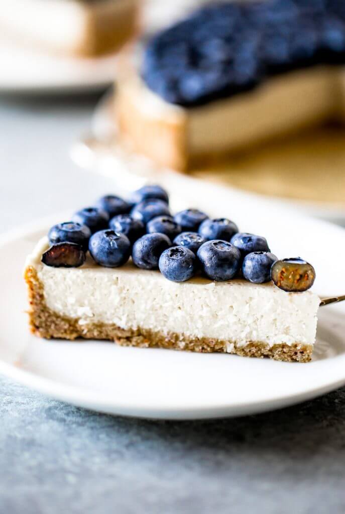 Blueberry creamy pie made with dairy-free coconut cream filling and homemade paleo coconut flour crust. Fresh and easy summer dessert topped with plenty of fresh blueberries! An easy paleo blueberry cream pie recipe. #pie #baking #recipes #paleo #cooking #dessert