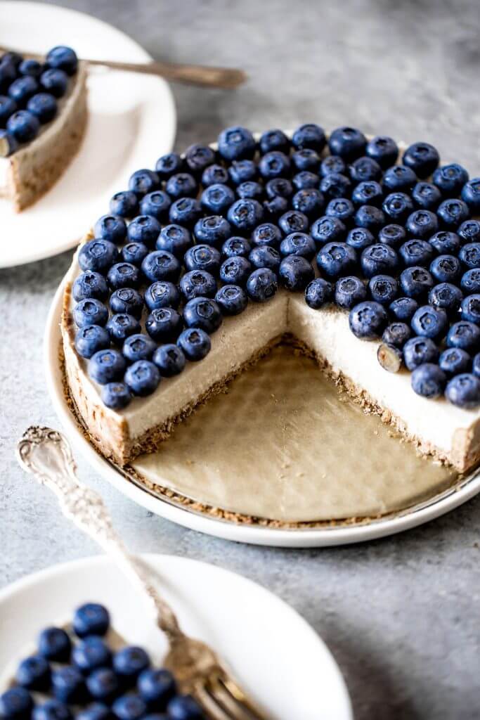 Blueberry creamy pie made with dairy-free coconut cream filling and homemade paleo coconut flour crust. Fresh and easy summer dessert topped with plenty of fresh blueberries! An easy paleo blueberry cream pie recipe. #pie #baking #recipes #paleo #cooking #dessert