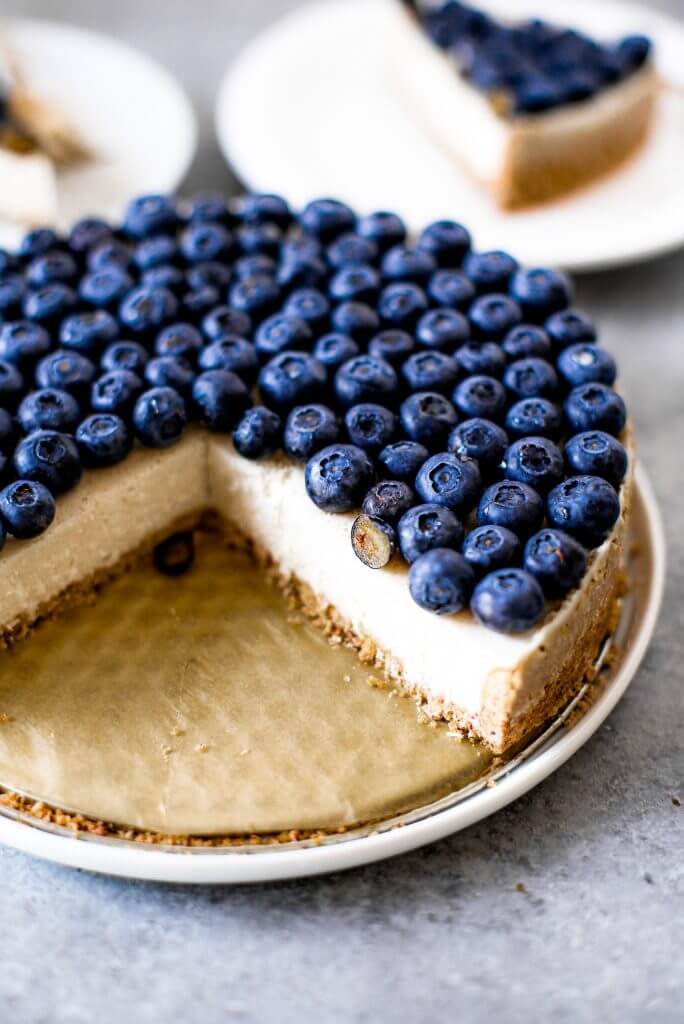 Blueberry creamy pie made with dairy-free coconut cream filling and homemade paleo coconut flour crust. Fresh and easy summer dessert topped with plenty of fresh blueberries! An easy paleo blueberry cream pie recipe. #pie #baking #recipes #paleo #cooking #dessert