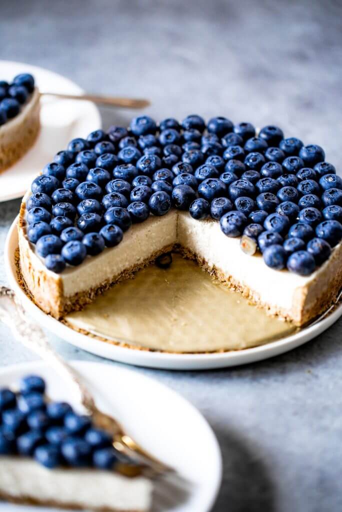 Blueberry creamy pie made with dairy-free coconut cream filling and homemade paleo coconut flour crust. Fresh and easy summer dessert topped with plenty of fresh blueberries! An easy paleo blueberry cream pie recipe. #pie #baking #recipes #paleo #cooking #dessert