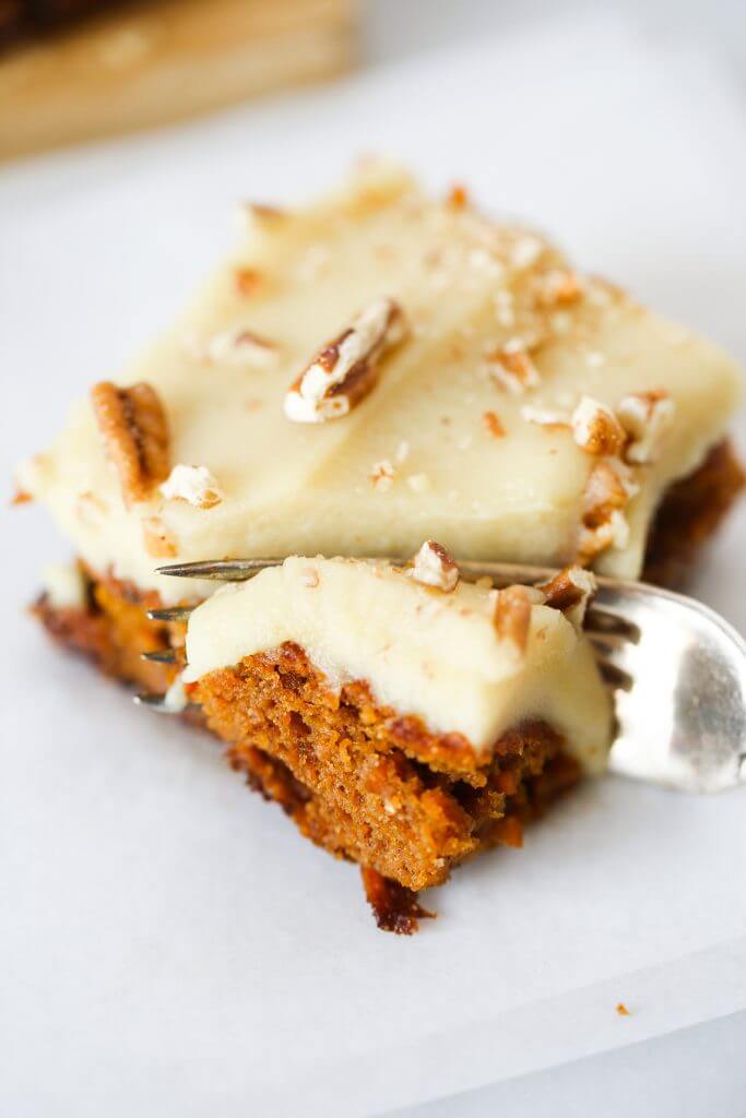 Paleo carrot cake made with sweet potatoes instead of flour. 159 calorie gluten free carrot cake. This cake is so delicious you won't even know it's healthy! Whipped lemon frosting is also made from sweet potatoes! #paleo #baking #cake #recipes #dessert