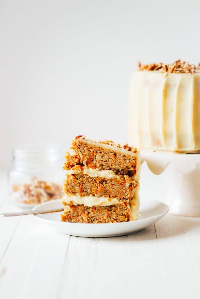 Paleo carrot cake made with sweet potatoes. Topped with creamy lemon frosting made from white sweet potatoes. A healthy carrot cake recipe that is gluten free and dairy free. Moist and flavorful carrot cake perfect for spring! #cake #baking #paleo #recipes