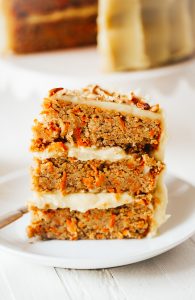 Paleo carrot cake made with sweet potatoes. Topped with creamy lemon frosting made from white sweet potatoes. A healthy carrot cake recipe that is gluten free and dairy free. Moist and flavorful carrot cake perfect for spring! #cake #baking #paleo #recipes