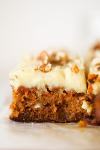 Paleo carrot cake made with sweet potatoes instead of flour. 159 calorie gluten free carrot cake. This cake is so delicious you won't even know it's healthy! Whipped lemon frosting is also made from sweet potatoes! #paleo #baking #cake #recipes #dessert