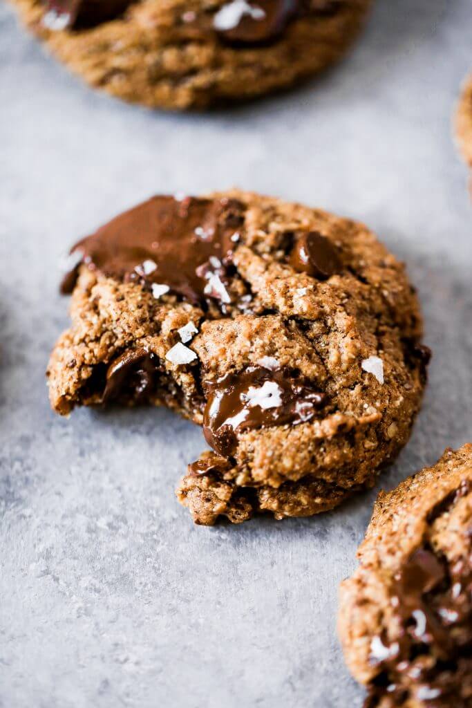 Paleo chocolate chip cookies made with hazelnut flour. Thick and soft cookies with gooey chocolate in the center. An easy paleo cookie recipe for dessert time! You can even make ahead and freeze for later.#cookies #paleo #baking #recipes #dessert #chocolate