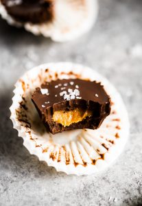 Healthier chocolate peanut butter cups. Make at home with this easy and fast recipe! See directions for a paleo version too. You’re not gonna want to go back, once you have tasted these. Enjoy! #dessert #baking #recipes #paleo #chocolate #vegan