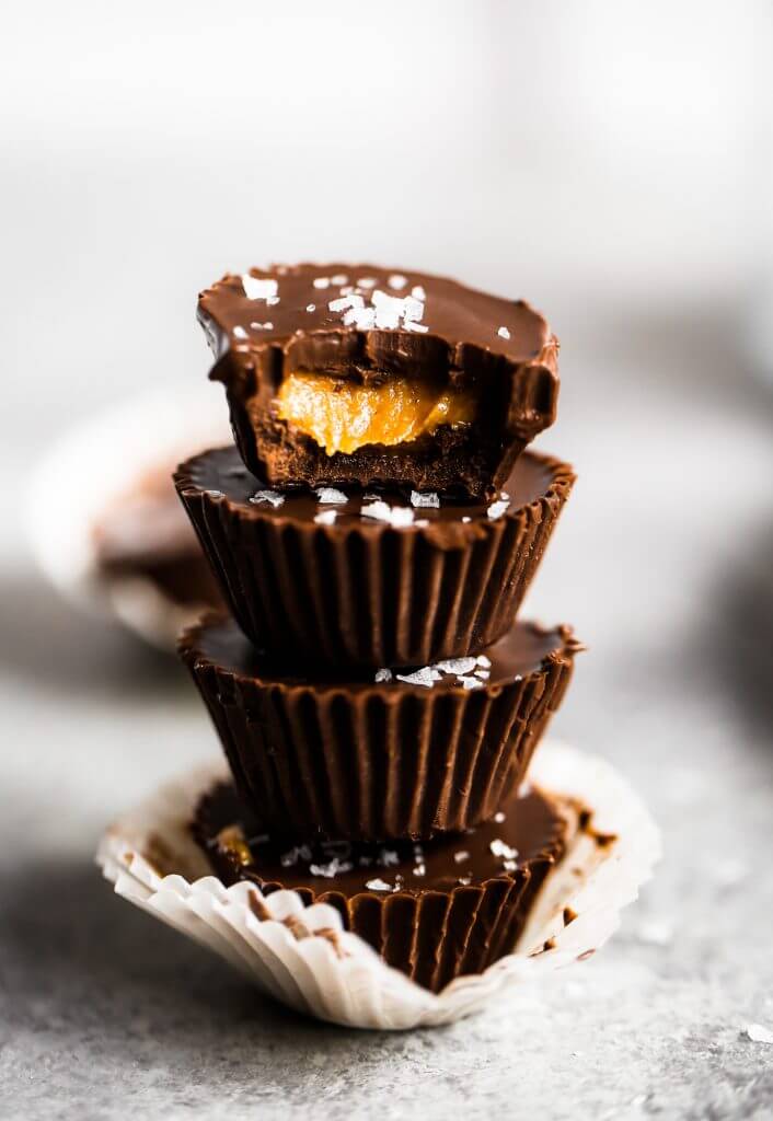 Healthier chocolate peanut butter cups. Make at home with this easy and fast recipe! See directions for a paleo version too. You’re not gonna want to go back, once you have tasted these. Enjoy! #dessert #baking #recipes #paleo #chocolate #vegan