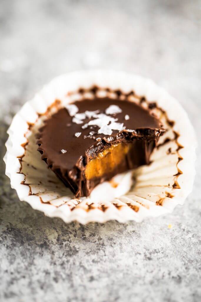 Healthier chocolate peanut butter cups. Make at home with this easy and fast recipe! See directions for a paleo version too. You’re not gonna want to go back, once you have tasted these. Enjoy! #dessert #baking #recipes #paleo #chocolate #vegan