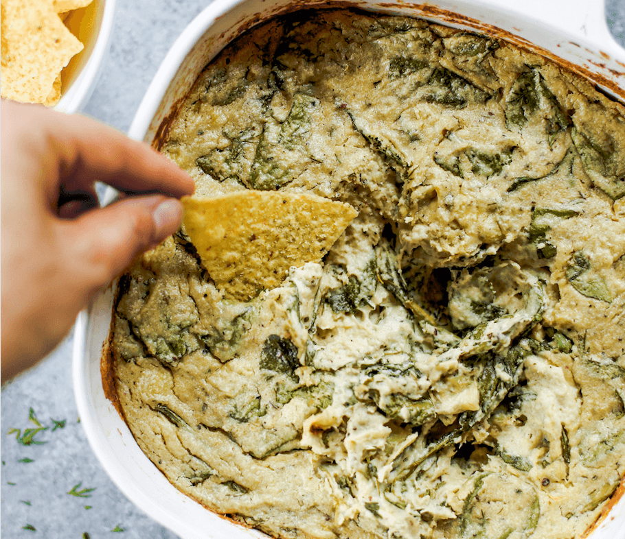 Creamy vegan artichoke dip made with cashews instead of dairy. A healthy snack and dip for veggie sticks, crackers, or bread. This paleo artichoke dip recipe is so easy to make and will keep you full and satisfied. #paleo #vegan #cooking #recipes #healthy #dairyfree