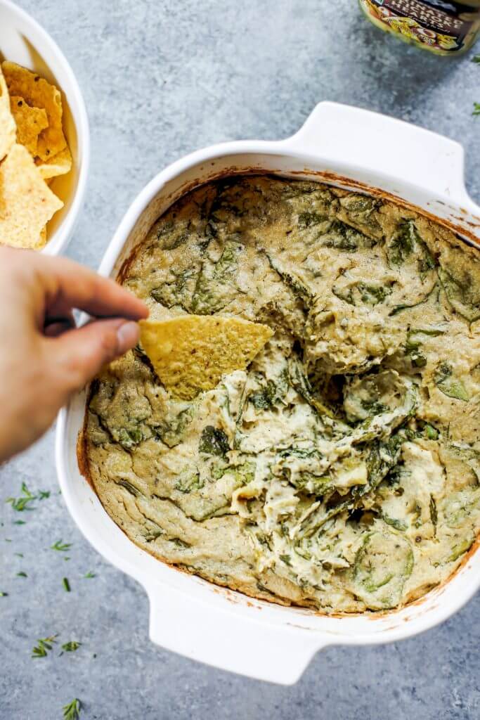 Creamy vegan artichoke dip made with cashews instead of dairy. A healthy snack and dip for veggie sticks, crackers, or bread. This paleo artichoke dip recipe is so easy to make and will keep you full and satisfied. #paleo #vegan #cooking #recipes #healthy #dairyfree