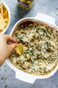 Creamy vegan artichoke dip made with cashews instead of dairy. A healthy snack and dip for veggie sticks, crackers, or bread. This paleo artichoke dip recipe is so easy to make and will keep you full and satisfied. #paleo #vegan #cooking #recipes #healthy #dairyfree