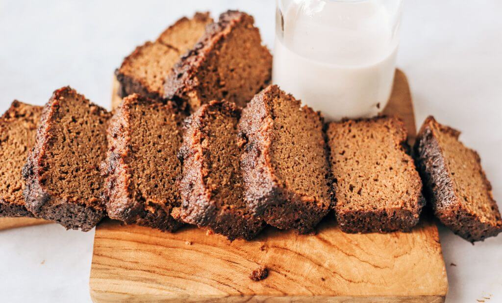 Easy recipe for healthy paleo gingerbread- made with sweet potatoes instead of flour! This loaf is such a yummy fall treat that is easy to make in a food processor. Gluten free, grain free, and dairy free gingerbread made with real ingredients. Kid approved!