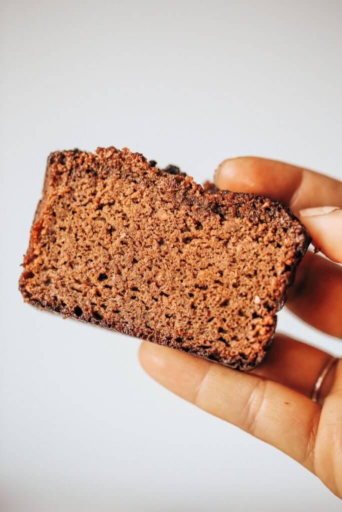 Easy recipe for healthy paleo gingerbread- made with sweet potatoes instead of flour! This loaf is such a yummy fall treat that is easy to make in a food processor. Gluten free, grain free, and dairy free gingerbread made with real ingredients. Kid approved!