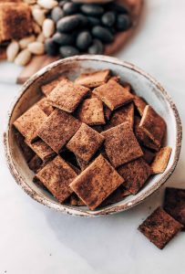 Pumpkin fall spice crackers made with sweet potatoes instead of flour! These grain free and paleo crackers are full of autumn flavors, nice and crunchy, and are perfect paired with a side of vanilla yogurt dip or served on a cheese board.