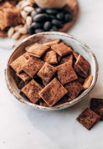 Pumpkin fall spice crackers made with sweet potatoes instead of flour! These grain free and paleo crackers are full of autumn flavors, nice and crunchy, and are perfect paired with a side of vanilla yogurt dip or served on a cheese board.