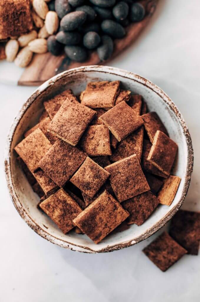 Pumpkin fall spice crackers made with sweet potatoes instead of flour! These grain free and paleo crackers are full of autumn flavors, nice and crunchy, and are perfect paired with a side of vanilla yogurt dip or served on a cheese board.