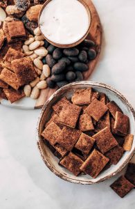 Pumpkin fall spice crackers made with sweet potatoes instead of flour! These grain free and paleo crackers are full of autumn flavors, nice and crunchy, and are perfect paired with a side of vanilla yogurt dip or served on a cheese board.