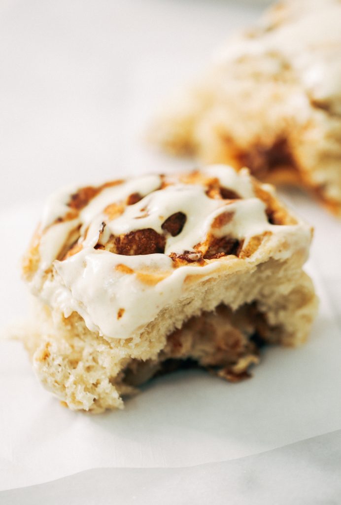 Fluffy Vegan Cinnamon Rolls made with coconut oil, almond milk, and no refined sugar! These healthier cinnamon rolls are light, fluffy, gooey, and delicious. You can make these vegan with cashew cream cheese frosting- yum!