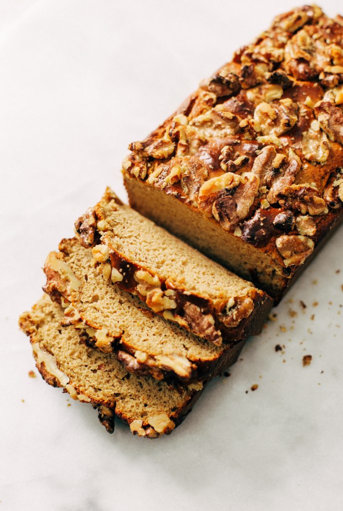 Paleo banana bread made with no sugar! Fruit sweetened flourless banana bread recipe that's easy to make in the blender. Light, fluffy, and moist healthy banana bread for spring baking.