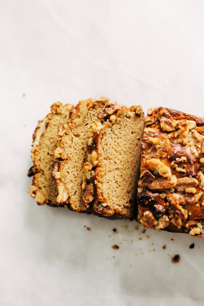 Paleo banana bread made with no sugar! Fruit sweetened flourless banana bread recipe that's easy to make in the blender. Light, fluffy, and moist healthy banana bread for spring baking.