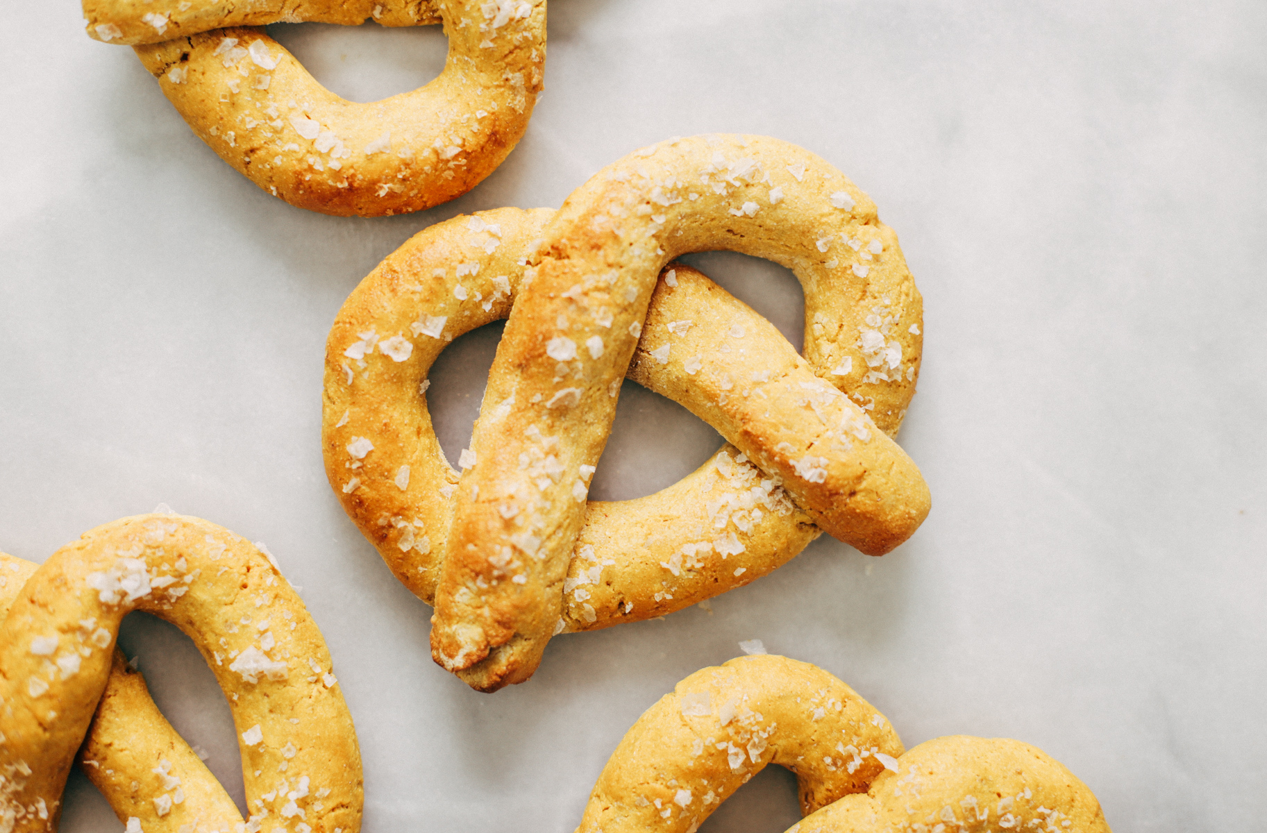 Paleo pretzels made with sweet potato! These gluten-free pretzels are easy to make and they are soft and chewy, like a real soft-baked pretzel. Can't stop eating them!